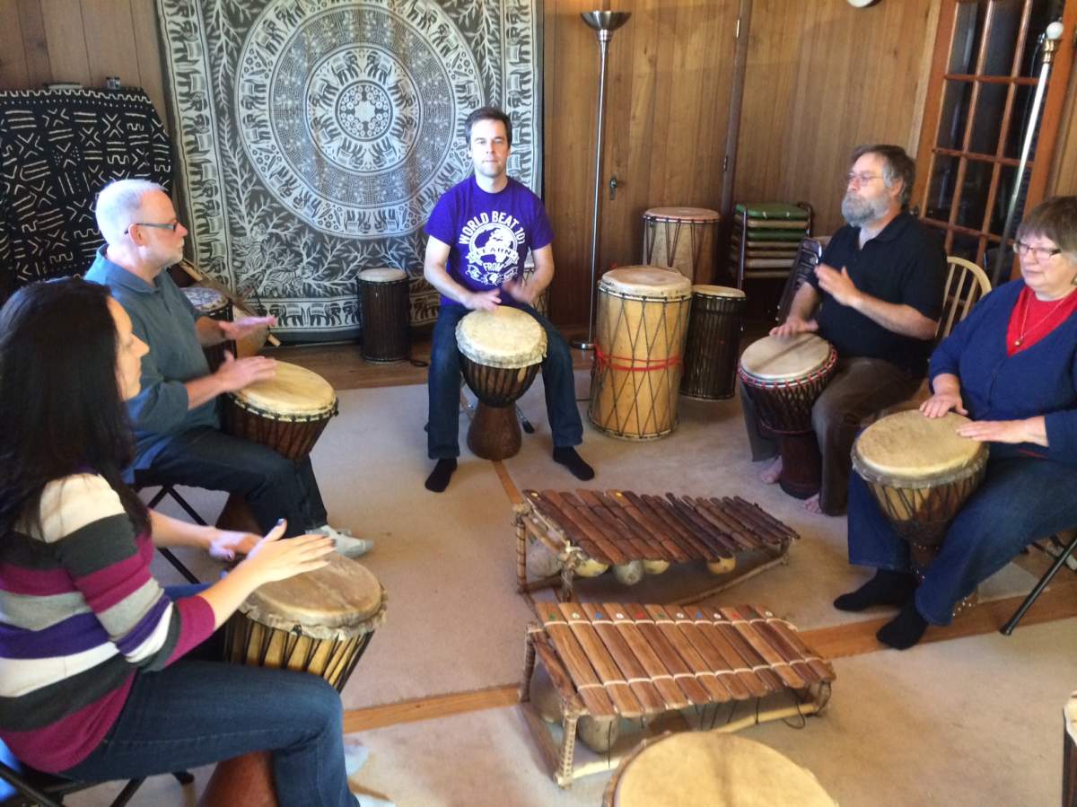 Drum teacher Jordan Hanson introduces African drumming to local musicians on Saturday.