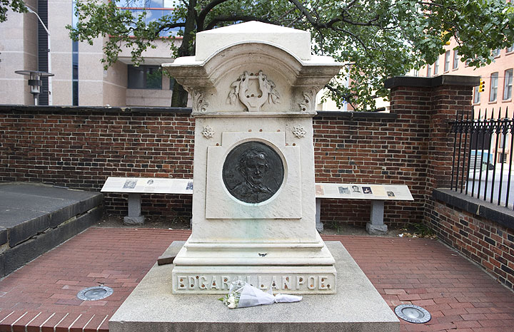 Flowers rest on the burial site of US author Edgar Allan Poe at Westminster Hall in Baltimore, Maryland, on August 11, 2011.