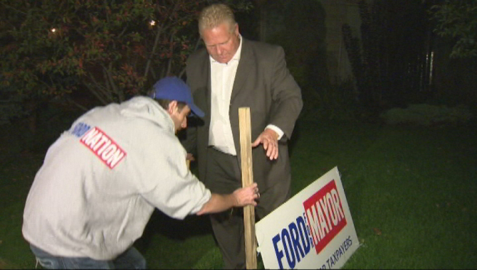 Doug Ford joins volunteers to put up campaign signs on Oct. 2, 2014.