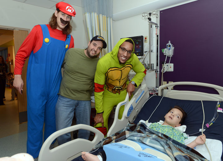  Boston Celtics Kelly Olynyk (L) and Evan Turner spend time with Colby and Dad at Boston Children's Hospital October 24, 2014 in Boston, Massachusetts. 