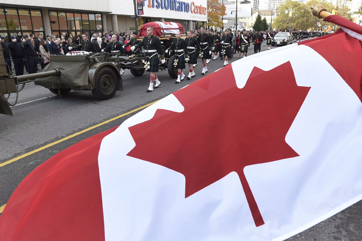 The coffin of Cpl. Nathan Cirillo is towed on a gun carriage during his funeral procession in Hamilton, Ont. on Tuesday October 28, 2014.