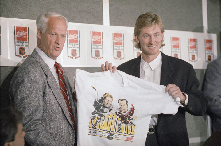 Hockey superstars Wayne Gretzky, right, and Gordie Howe hold up T-shirt featuring them as "Legends on Ice" during a news conference at the Forum in Inglewood, on Wednesday, Oct. 11, 1989.