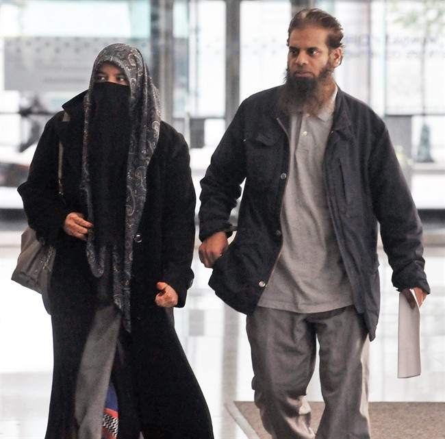 The parents of Mohammed Hamzah Khan, a 19-year-old U.S. citizen from Bolingbrook, Ill., leave the Dirksen federal building Monday, Oct. 6, 2014 in Chicago. Their son, Mohammed Hamzah Khan, was was arrested Saturday at O'Hare International Airport, from where he intended to travel to Turkey so that he could sneak into Syria to join the Islamic State group, according to criminal complaint released Monday.(AP Photo/Sun-Times Media, Al Podgorski) .