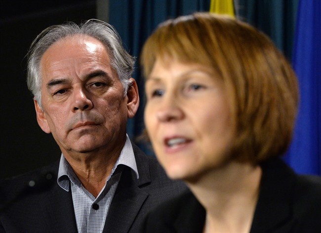 Assembly of First Nations National Chief Ghislain Picard looks on as First Nations Child and Family Caring Society of Canada (Caring Society) Executive Director Cindy Blackstock speaks during a press conference on Parliament Hill in Ottawa on Monday, Oct. 20, 2014. THE CANADIAN PRESS/Sean Kilpatrick.