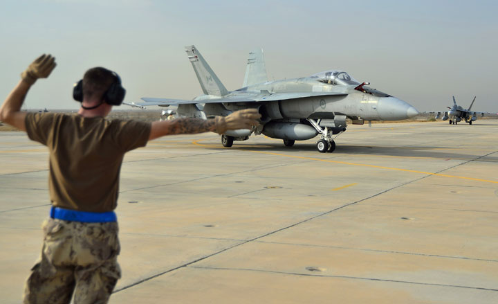 A Canadian Armed Forces CF-18 Fighter jet from 409 Squadron taxis after landing in Kuwait on Tuesday October 28, 2014. THE CANADIAN PRESS/HO, DND-MND.