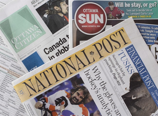 Postmedia newspapers, including the National Post and Ottawa Citizen, are shown with Quebecor Media's Ottawa Sun on Monday, Oct. 6, 2014. Postmedia Network announced it would purchase 175 of Quebecor's English language newspapers, including the Toronto Sun and Ottawa Sun.