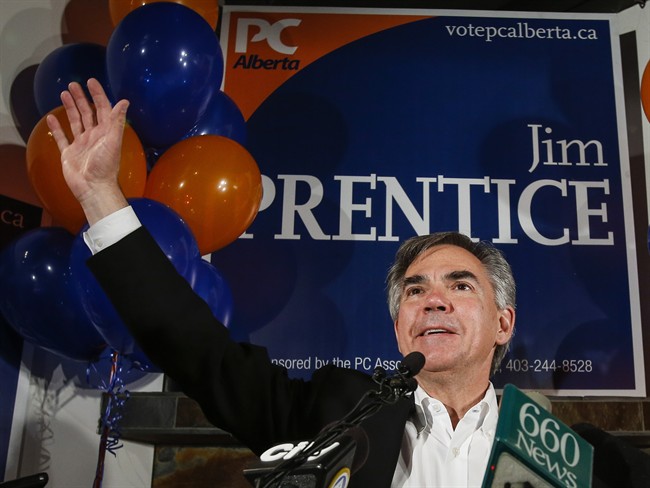 Alberta Premier Jim Prentice celebrates after winning a seat in the provincial legislature following a byelection in Calgary, Monday, Oct. 27, 2014. 