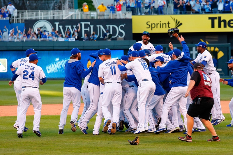 The Kansas City Royals celebrate their 2 to 1 win over the Baltimore Orioles to sweep the series in Game Four of the American League Championship Series at Kauffman Stadium on October 15, 2014 in Kansas City, Missouri. (Photo by Ed Zurga/Getty Images).
