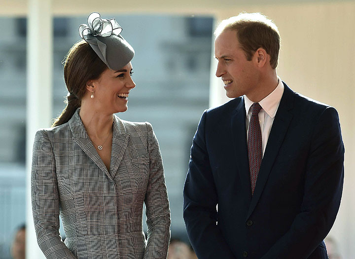 Catherine, Duchess of Cambridge and Prince William, Duke of Edinburgh smile at each other during a ceremonial welcome for the President of Singapore at Horse Guards Parade on October 21, 2014 in London, England.