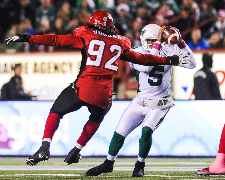 Brandon Jordan #92 of the Calgary Stampeders tries to stop Kerry Joseph #5 of the Saskatchewan Roughriders during a CFL game at McMahon Stadium on October 24, 2014 in Calgary.
