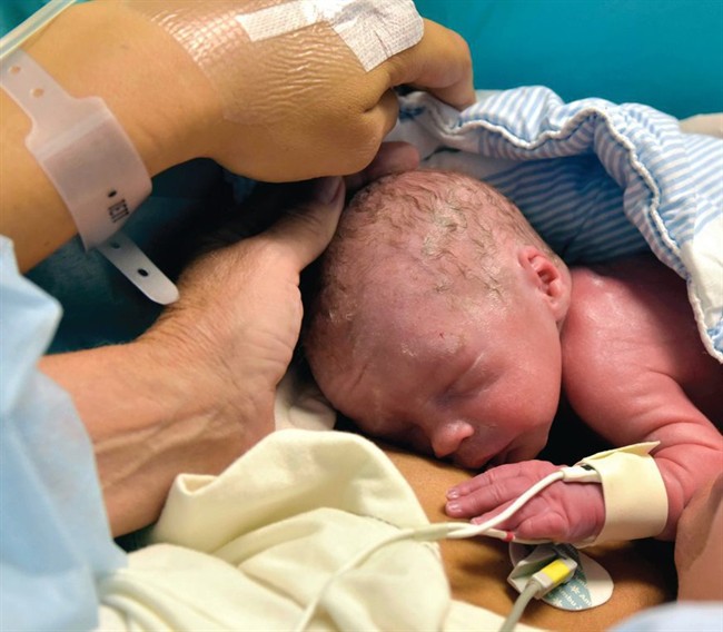 In this photo provided by the Lancet, the world's first baby born to a woman with a transplanted womb, is shown after his birth in Goteborg, Sweden.