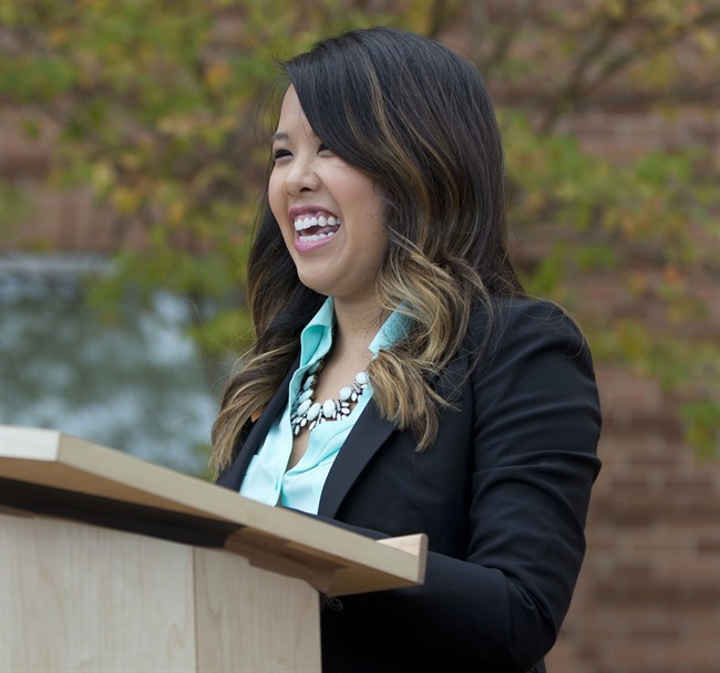 Nina Pham smiles as she speaks outside of National Institutes of Health (NIH) in Bethesda, Md., Friday, Oct. 24, 2014.