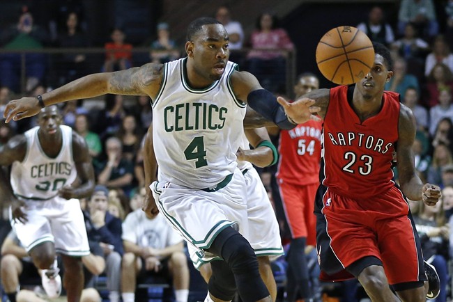 Boston Celtics guard Marcus Thornton (4) beats Toronto Raptors guard Louis Williams (23) to a loose ball during the first quarter of a preseason NBA basketball game in Portland, Maine, Wednesday, Oct. 15, 2014. 