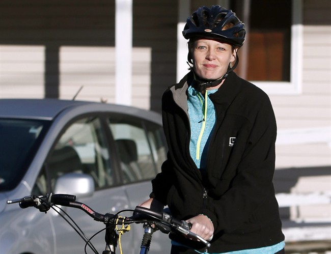 Nurse Kaci Hickox leaves her home on a rural road in Fort Kent, Maine, to take a bike ride with her boyfriend Ted Wilbur, Thursday, Oct. 30, 2014.