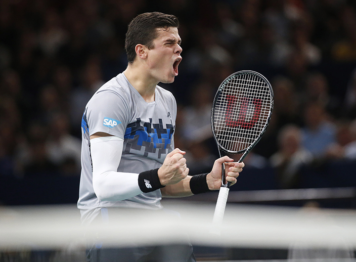 Milos Raonic celebrates his victory over Roger Federer of Switzerland during their quarterfinal match at the ATP World Tour Masters tennis tournament at Bercy stadium in Paris, France, Friday, Oct. 31, 2014.