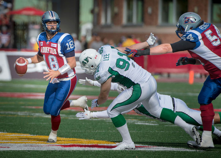 Montreal Alouettes Jonathan Crompton looks for an open receiver 2nd quarter CFL action against the Saskatchewan Roughriders in Montreal, Quebec, Monday October 13, 2014.