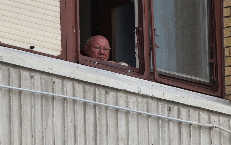 In this July 28, 2014, photo, Jakob Denzinger looks from his apartment window in Osijek, eastern Croatia. (AP Photo/Darko Bandic).