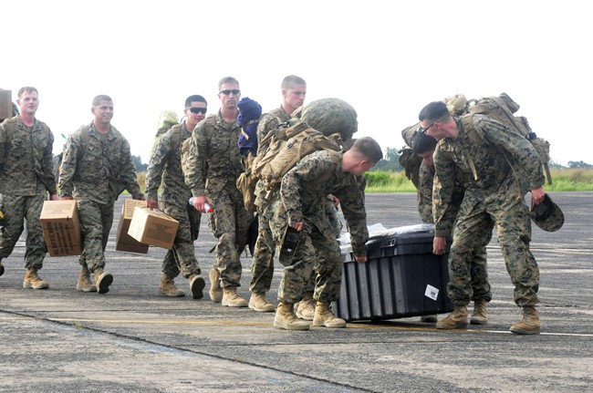 U.S marines arrival at the Roberts International airport in Monrovia, Liberia, Thursday, Oct. 9, 2014. Six U.S. military planes arrived Thursday at the epicenter of the Ebola crisis, carrying more aid and American Marines into Liberia, the country hardest hit by the deadly disease that has devastated West Africa and stirred anxiety across a fearful world.