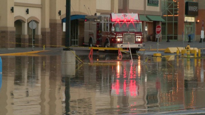 Water main rupture floods parking lot at Calgary mall - Calgary ...