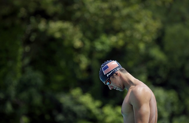 In this July 31, 2014, file photo, Michael Phelps pauses before a training session at Meadowbrook Aquatic and Fitness Center in Baltimore.
