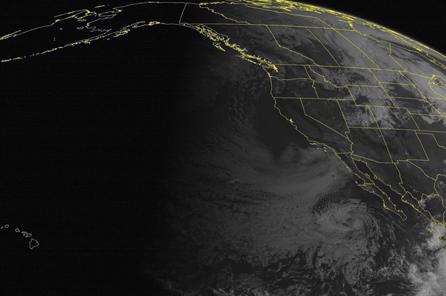 This NOAA satellite image taken Wednesday, October 01, 2014 at 11:00 AM EDT shows a likely tropical storm forming to the southwest of the Baja California Peninsula.