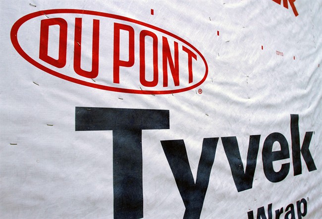 This Jan. 23, 2012 file photo shows a DuPont logo on sheets of Tyvek insulation covering a wall of a home under construction in Springfield, Ill.