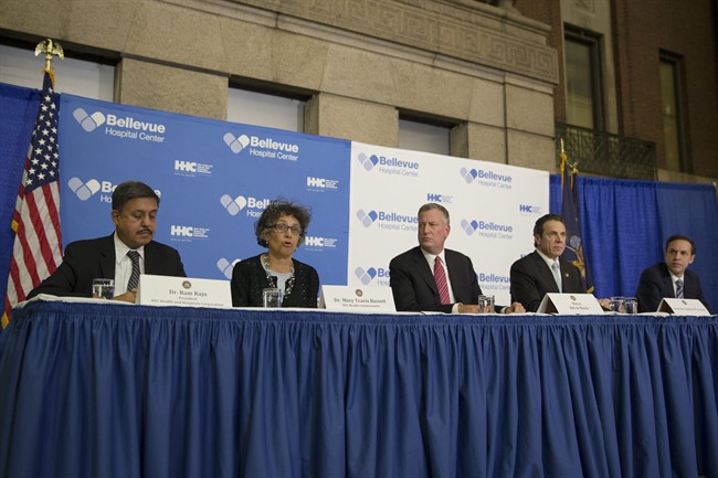 Dr. Mary Travis Basset, NYC Health Commissioner, second from left, speaks during a news conference at Bellevue Hospital to discuss Craig Spencer, a Doctors Without Borders physician who tested positive for the Ebola virus, Thursday, Oct. 23, 2014, in New York. Spencer recently returned to the city after treating Ebola patients in West Africa. (AP Photo/John Minchillo).