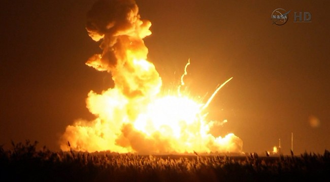 This image taken from video provided by NASA TV shows Orbital Sciences Corp.'s unmanned rocket blowing up over the launch complex at Wallops Island, Va., just six seconds after liftoff. The company says no one was believed to be hurt and the damage appeared to be limited to the facilities.