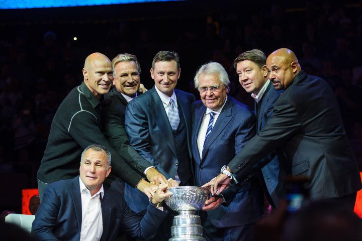 Paul Coffey, Mark Messier, Glenn Anderson, Wayne Gretzky, Glen Sather, Jari Kurri, and Grant Fuhr pose with the Stanley Cup during the Edmonton Oilers Stanley Cup Reunion at Rexall Place on October 10, 2014 in Edmonton, Alberta, Canada. 