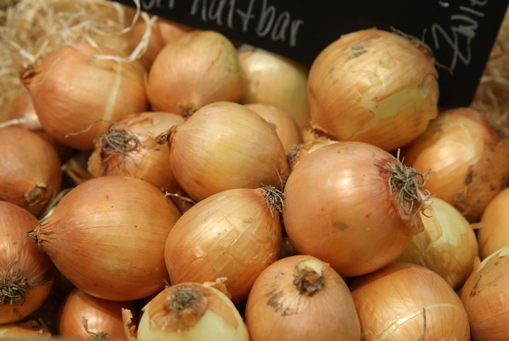 Organic onions lie on display on Sept. 5, 2014.
