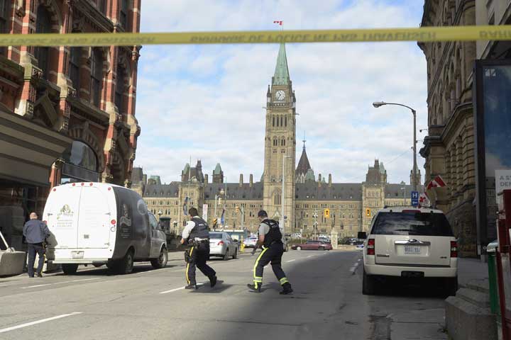 Police secure the scene of a shooting on Parliament Hill in Ottawa on Wednesday Oct.22, 2014. 