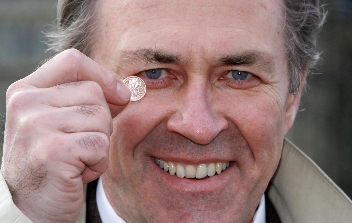 NDP MP Pat Martin holds a penny in Ottawa Thursday, March 29, 2012. THE CANADIAN PRESS/Fred Chartrand.
