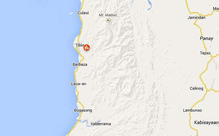 A magnitude 5.7 earthquake jolted the central Philippines on Friday, sending workers out of their offices and causing cracks on a building's wall.