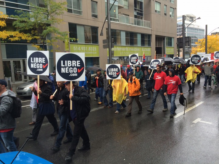 1,500 unionized workers  march against bill 3 through business district of downtown.