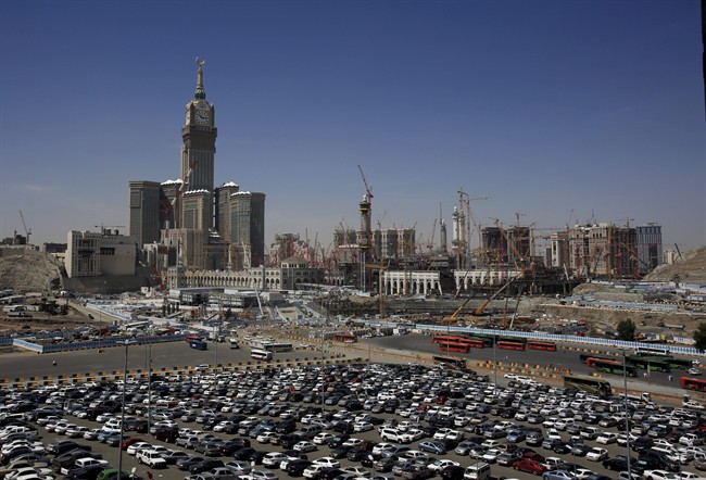 In this Tuesday, May 13, 2014 photo, construction cranes and scaffolding dominate the minarets and entries to the Kaaba at Mecca, Saudi Arabia, where a major expansion project is revamping the holiest site in Islam. 