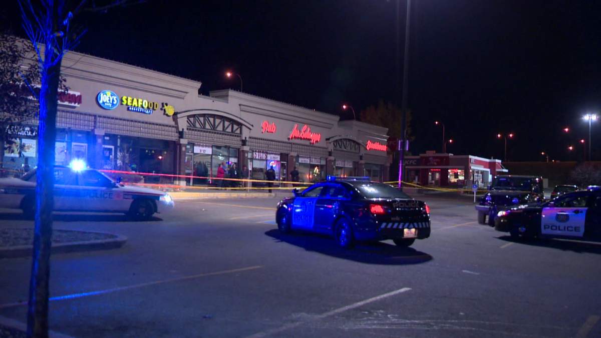 Police investigate a shooting at Mr. Schnapps, located in the block of 52nd Street N.E.