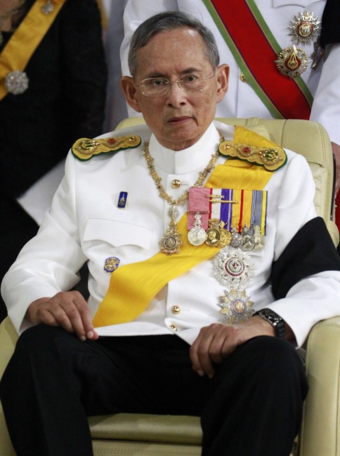 FILE - In this April 9, 2012 file photo, Thai King Bhumibol Adulyadej is pushed on a wheelchair as he leaves Siriraj hospital to preside over the royal cremation of his cousin Princess Bejaratana Rajasuda Sirisobhabannavadi in Bangkok, Thailand. 