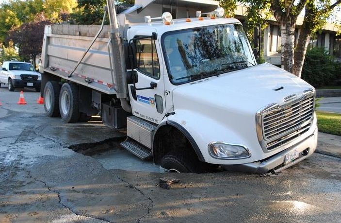 Vernon truck falls into sinkhole - image