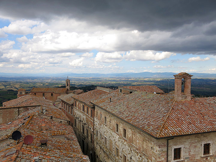 This June 14, 2014 photo shows a view of rooftops in Montepulciano, a city in Tuscany, Italy, famous for its food and wine. Walking tours of Tuscany offer many stops in places like Montepulciano, with scenic views, history and fine wine and dining.