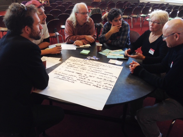 Citizens of Winnipeg gather to review the Winnipeg's Great Transition document Saturday.