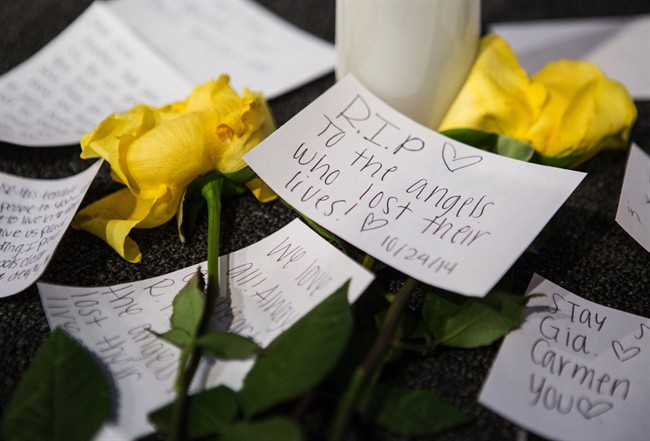 Messages of support on the stage near candles and flowers in between morning services at The Grove Church in Marysville, Wash., two days after the Marysville-Pilchuck High School shooting, on Sunday, Oct. 26, 2014. (AP Photo/The Seattle Times, Lindsey Wasson).