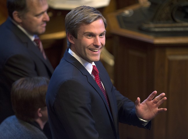 Brian Gallant waves to the gallery as he is sworn in as New Brunswick's 33rd premier in Fredericton on Oct. 7, 2014.