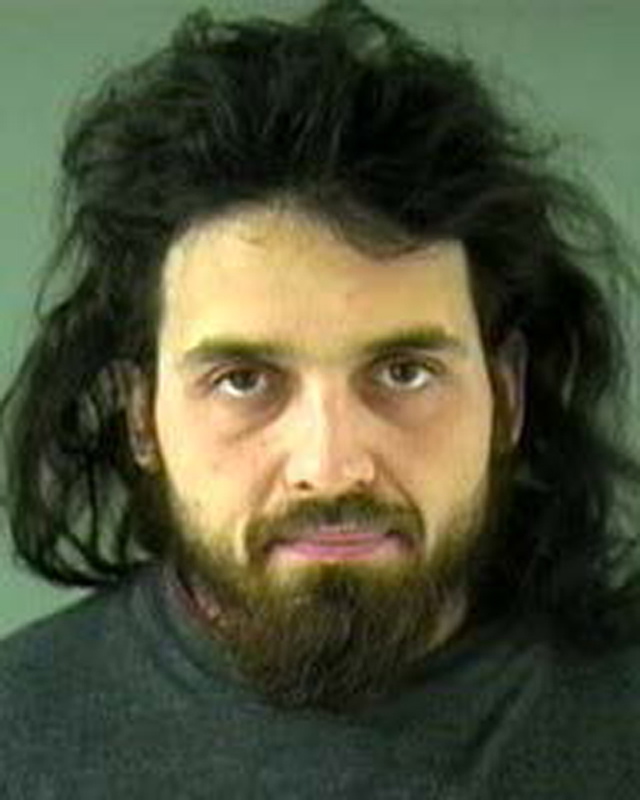 This image provided by the Royal Canadian Mounted Police shows and undated image of Michael Zehaf-Bibeau, 32, who shot a soldier to death at Canada's national war memorial Wednesday, Oct. 22, 2014 and was eventually gunned down inside Parliament by the sergeant-at-arms. (AP Photo/Vancouver Police via The Royal Canadian Mounted Police).