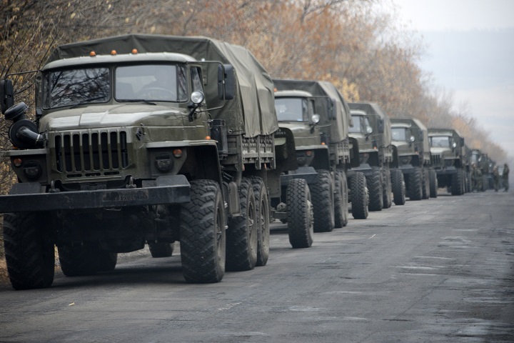 Unmarked military vehicles parked on a road outside the separatist rebel-held eastern Ukrainian town of Snizhne, 80 kilometers (50 miles) from Donetsk on Saturday Nov. 8, 2014. 
