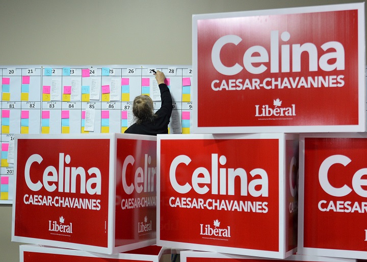 A volunteer posts early results at the Liberal headquarters for candidate Celina Caesar-Chavannes on Monday Nov. 17, 2014 in Whitby, Ont. 
