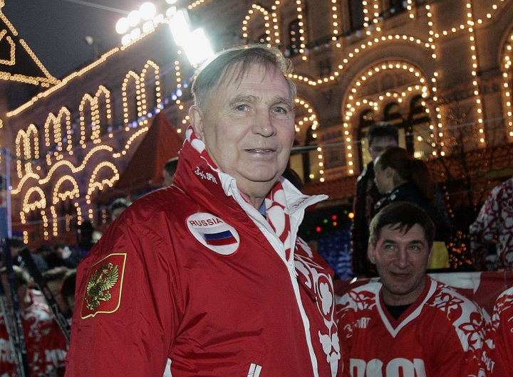 In this Saturday, Dec. 9, 2006 file photo, Legendary Soviet ice hockey coach Viktor Tikhonov, centre, stands at the "Team USSR" bench prior to the charity ice hockey match, at the Moscow's Red Square. The legendary Russian hockey coach Viktor Tikhonov, whose teams won three Olympic gold medals, has died after an undisclosed long illness. He was 84. Russia's Kontinental Hockey League said early Monday, Nov. 24, 2014,  that Tikhonov died overnight. He had been receiving treatment at home for an illness that had left him unable to walk in recent weeks.
