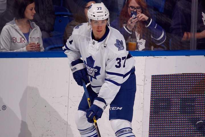 Carter Ashton #37 of the Toronto Maple Leafs skates against the New York Islanders at the Nassau Veterans Memorial Coliseum on October 21, 2014 in Uniondale, New York.