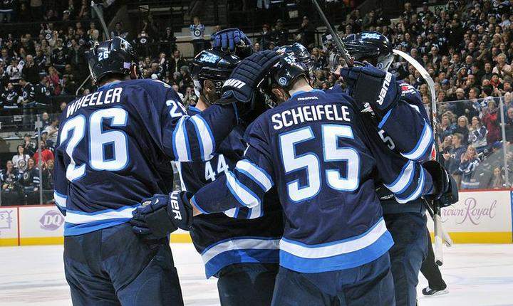 Mark Scheifele went down with another knee injury during Sunday's game on the road against the Minnesota Wild.