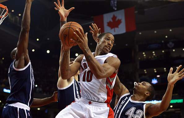 DeMar DeRozan #10 of the Toronto Raptors looks to make a pass as Lance Thomas #42, Nick Collison #4, and Serge Ibaka #9 all of the Oklahoma City Thunder defend during their game at Air Canada Centre on November 4, 2014 in Toronto, Canada.
