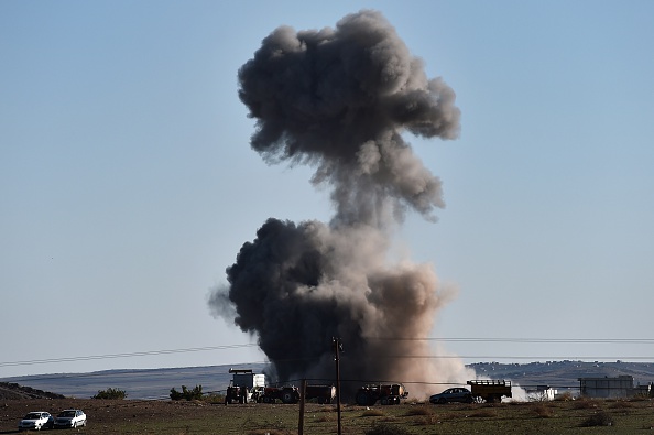 Smoke rises after an airstrike in the city of Kobane, also known as Ain al-Arab, as it seens from the southeastern border village of Mursitpinar, Sanliurfa province, on November 5, 2014.  